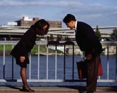 Korean man and woman, bowing courteously